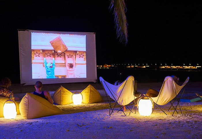 Nightlife at The Standard, Huruvalhi Maldives. Outdoor cinema on the beach, with beanbags and chairs. Best gay hotel in Maldives.