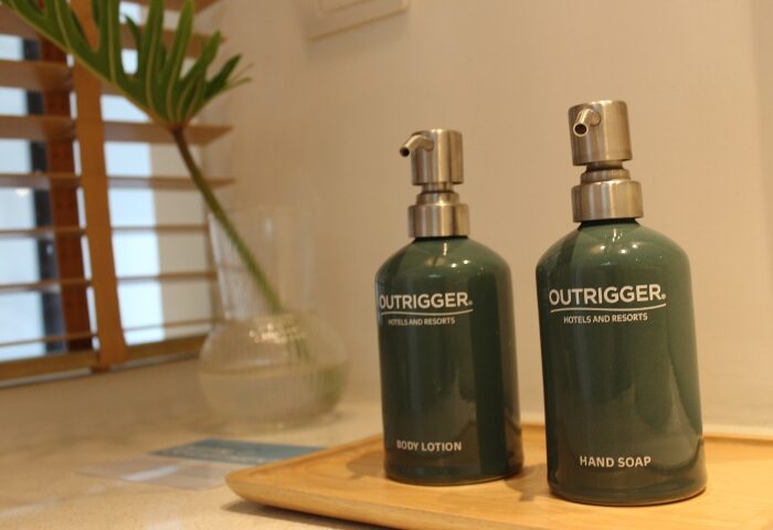 Spa treatment at Outrigger Surin Beach Resort, Phuket, Thailand. Body lotion and hand soap on a wooden tray. Best gay hotel.