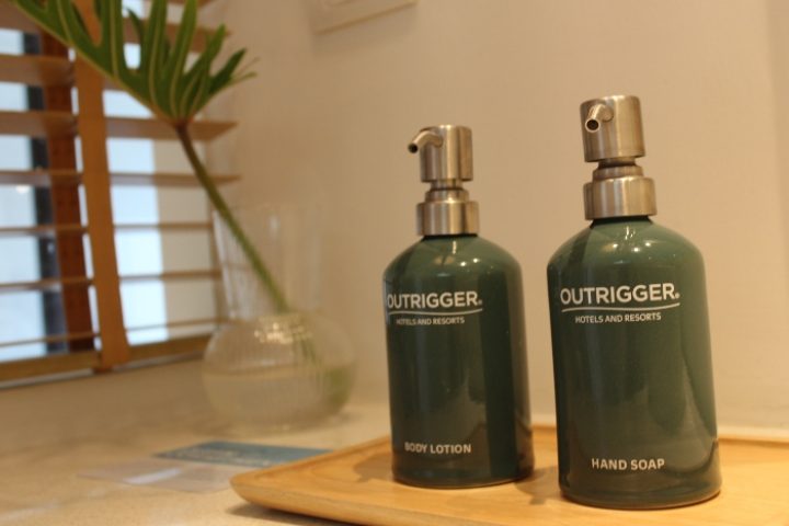 Spa treatment at Outrigger Surin Beach Resort, Phuket, Thailand. Body lotion and hand soap on a wooden tray. Best gay hotel.