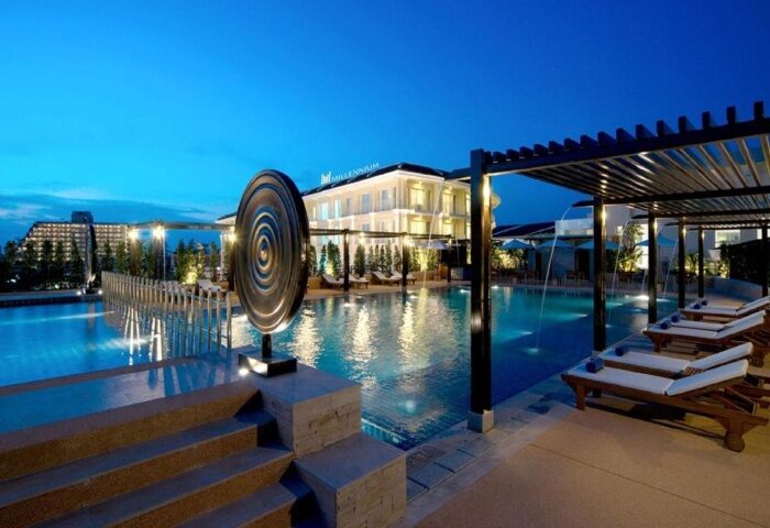 M Social Hotel Phuket pool at night. Best gay hotels Patong Beach near gay bars. Luxury travel destination for gay men.