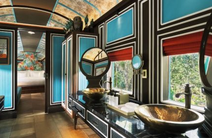 InterContinental Khao Yai Resort bathroom. Gay jungle hotels near Bangkok. Luxury train suite with gold sinks and jungle view.