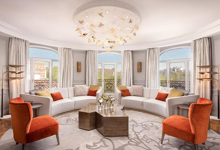 Westin Palace Madrid suite. Best gay luxury hotel in Madrid's Gran Via gayborhood. Elegant seating area, bright, modern design.