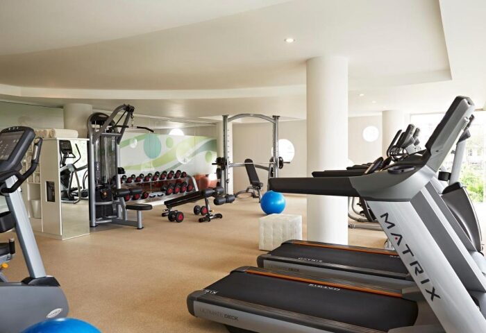 Double-Six Luxury Hotel Seminyak's gym in Bali. Best gay wellness hotel with treadmills, weights, and fitness equipment for a healthy stay.