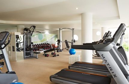 Double-Six Luxury Hotel Seminyak's gym in Bali. Best gay wellness hotel with treadmills, weights, and fitness equipment for a healthy stay.