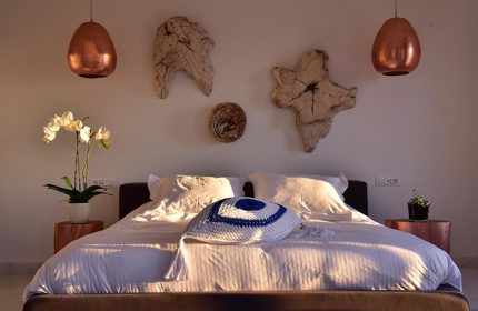 Hermes Mykonos Hotel bedroom. Best honeymoon hotel in Mykonos Town, Greece. Inspiration for gay travelers. Modern decor and relaxing atmosphere.