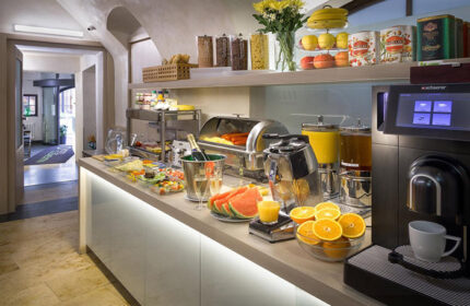 Hotel Clementin Old Town's best breakfast in Prague. A buffet with cereals, fruit, salad, juice, champagne, and coffee in the city center.