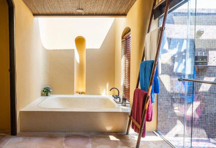 Paradee Resort's luxury bathroom with tub and ladder towel rack. Best Koh Samet beachfront hotel for gay travelers. Instagram worthy design.