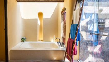Paradee Resort's luxury bathroom with tub and ladder towel rack. Best Koh Samet beachfront hotel for gay travelers. Instagram worthy design.