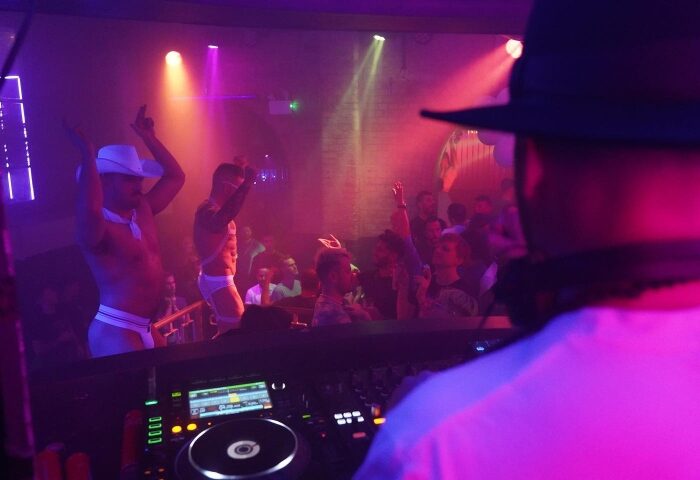 CIRCA The Club: Best Live DJ night at a gay dance club in London. Dancers, crowd, and DJ in a vibrant, energetic atmosphere.