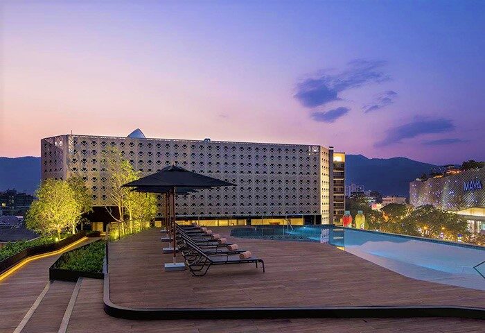 U Nimman Chiang Mai hotel rooftop pool at dusk. Luxury gay travel destination in Thailand. Best location, most booked hotel.