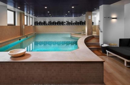 Indoor pool at Sofitel Legend The Grand Amsterdam, a luxury hotel. Swimming pool with lounge area. Best gay-friendly hotel in Amsterdam.