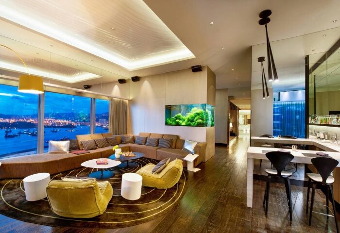 W Hong Kong hotel suite interior. Luxury gay hotel in Hong Kong city center with a view, aquarium, and modern design. Upscale travel.