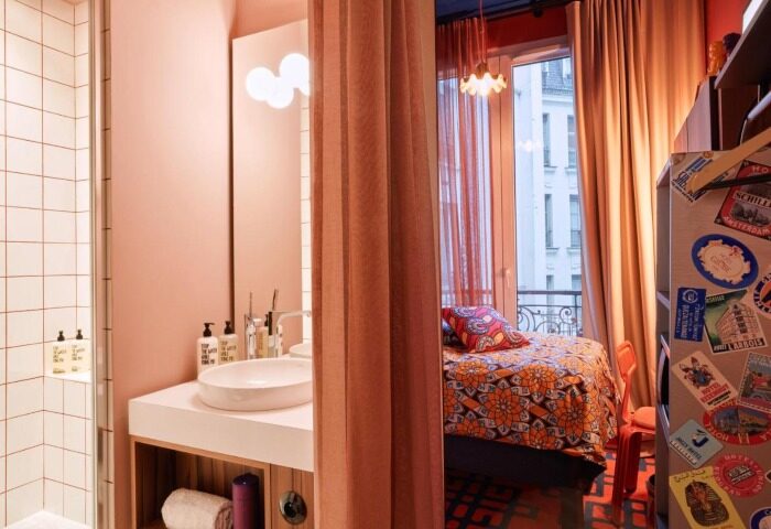 25hours Hotel Terminus Nord room. Paris hotel near gay bars, featuring eclectic decor, bathroom, and a view. Best Paris view hotel.
