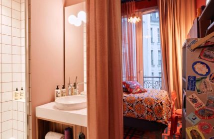 25hours Hotel Terminus Nord room. Paris hotel near gay bars, featuring eclectic decor, bathroom, and a view. Best Paris view hotel.
