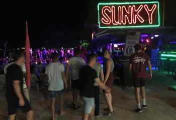 ChaoKoh Phi Phi Hotel Resort's beach party at Ton Sai. Slinky neon sign above the bar. Best party beach, gay hotel.