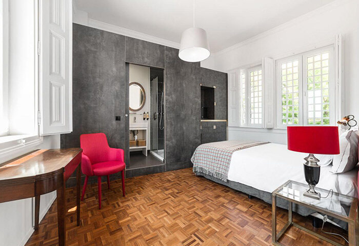 Monte Belvedere Hotel by Shiadu: Stylish Lisbon city center bedroom with ensuite bathroom, perfect for gay travelers seeking party hotels.