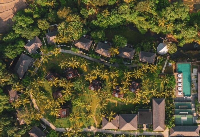 Aerial view of Nirjhara Bali, a gay-friendly hotel. Private pool villas amidst lush greenery. Best Bali travel destination for gay men.