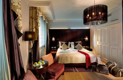 The Grand Mark Prague hotel room. Gay hotels in Prague city center offer best room offers. Luxury interior with double bed.