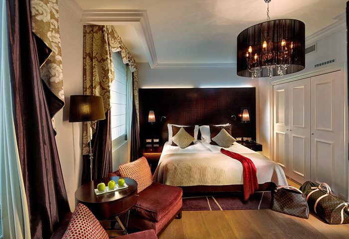 The Grand Mark Prague hotel room. Gay hotels in Prague city center offer best room offers. Luxury interior with double bed.