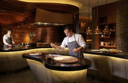 Chef preparing brunch at voco Orchard Singapore, an IHG Hotel. Best Sunday brunch offers at this gay-friendly Singapore hotel.