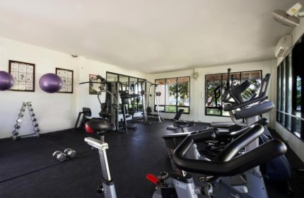 SAii Phi Phi Island Village's gym. Wellness and fitness equipment for gay travelers. Private beach resort with exercise bikes, weights, and machines.