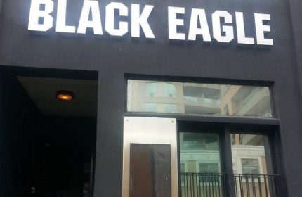 Black Eagle cruising bar in Toronto. Exterior shot of the popular gay bar, a nightlife destination for gay men visiting Toronto.