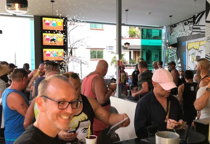 Gay party at Blondies Loft Slushbar in Puerto Vallarta. Men gather at the bar for drinks and socializing. Gay travel destination.