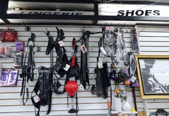 Inside a New York gay shop: fetish gear on display. Leather harnesses, lingerie, and other adult items for sale. Travel advice for gay men.