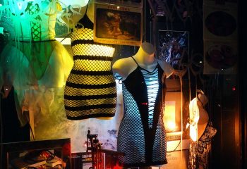 Window display of sexy apparel in New York City. Mannequins in revealing dresses. Nightlife fashion for gay men.