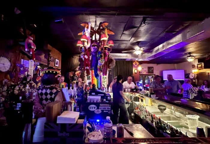 Bobby's Monkey Bar in Key West. A popular gay bar known for its strong drinks, karaoke, and quirky decor, including monkey dolls.