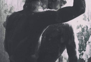 Two men in a shower at BodyBreath Cruise Club Tokyo, a gay cruise club. The photo is in black and white, with soap covering their bodies.