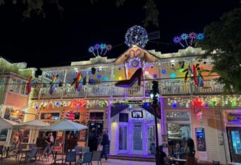 Bourbon St. Pub, Key West's gay bar with live music. Rainbow flags, lights, & a giant shoe decorate the building. Nightlife scene.