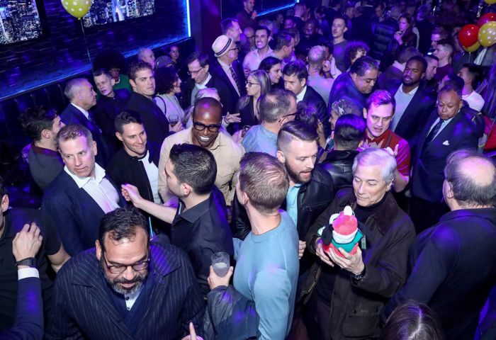 Boxers NYC gay sports bar crowd. Interior view of the New York City gay bar, filled with patrons socializing and enjoying the lively atmosphere.