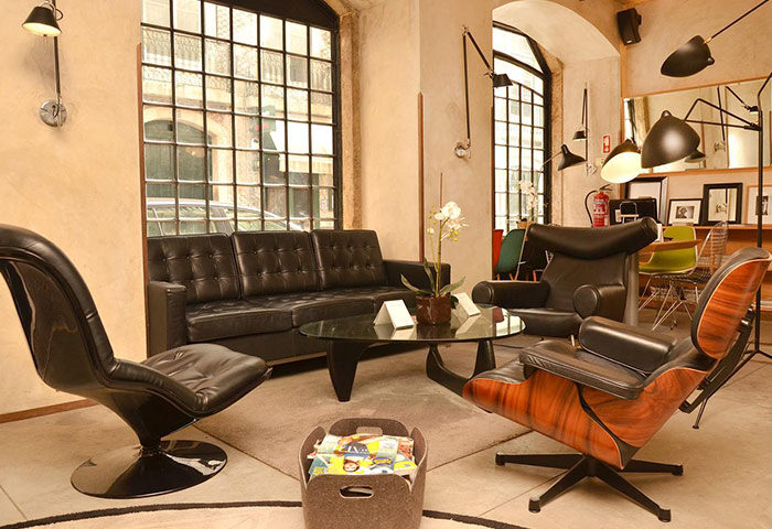 Browns Downtown Hotel, Lisbon. Lobby lounge area with mid-century modern furniture. Most booked gay hotel in Lisbon's gayborhood.