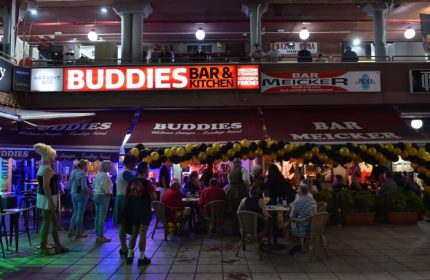 Buddies Bar, a popular gay bar in Gran Canaria, features outdoor seating and a lively atmosphere. A welcoming spot for gay men travelers.