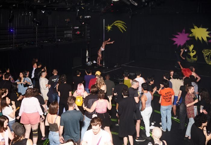 Buddies in Bad Times Theatre, Toronto: A pole dancer performs for a crowd. Gay travel advice, entertainment, and queer nightlife.