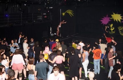 Buddies in Bad Times Theatre, Toronto: A pole dancer performs for a crowd. Gay travel advice, entertainment, and queer nightlife.