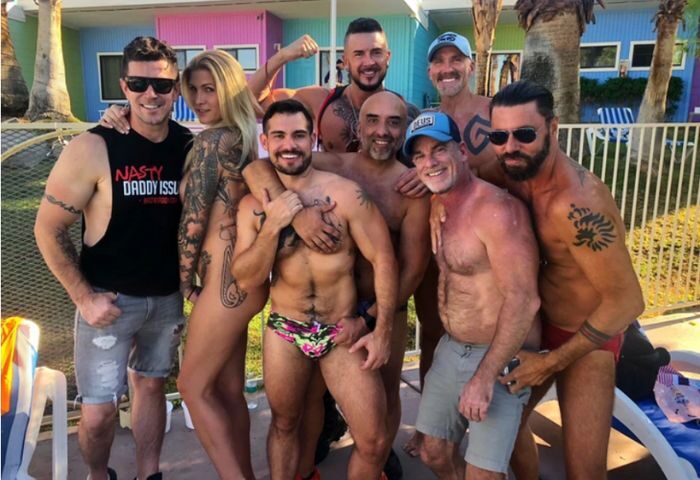 CCBC Resort Hotel Gay Cruise Palm Springs: Group of shirtless men and a woman posing for a photo at a gay resort.
