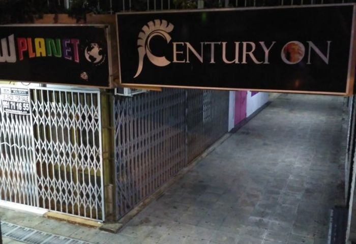 Centuryon Gay Club in Torremolinos. Entrance to a gay bar with metal gates. Gay travel advice for nightlife in Spain.