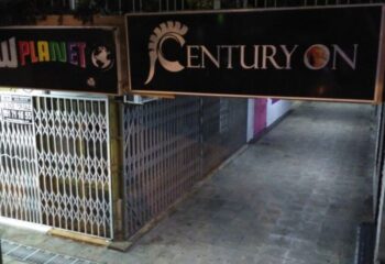 Centuryon Gay Club in Torremolinos. Entrance to a gay bar with metal gates. Gay travel advice for nightlife in Spain.