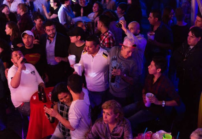 Cabaretito Fusion Gay Bar in Mexico crowd. People drinking, socializing, and enjoying the nightlife. Gay travel advice.