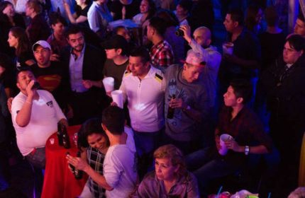 Cabaretito Fusion Gay Bar in Mexico crowd. People drinking, socializing, and enjoying the nightlife. Gay travel advice.