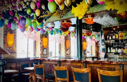 Centralhjørnet Copenhagen bar interior. Easter eggs hang from ceiling. Gay travel advice for Copenhagen's oldest gay bar.