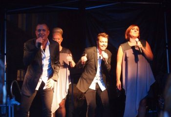 Centralhjornet Copenhagen: Band performs live on stage. Gay nightlife in Copenhagen. Travel advice for gay men. Music and entertainment.