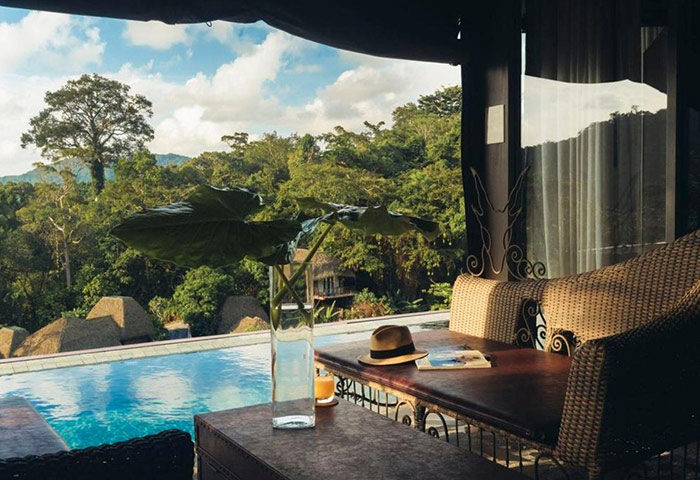 Keemala Phuket gay hotel: Luxury private infinity pool villa. Relax with a view of lush greenery, perfect for gay travel in Thailand.