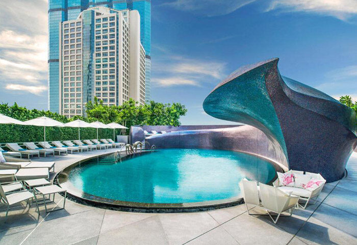 W Bangkok rooftop pool. This cheap city center gay hotel features a pool with a unique design, perfect for gay travelers.