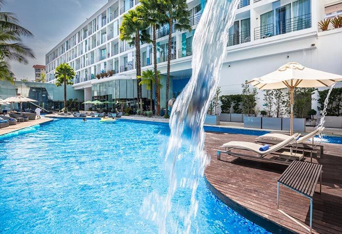 Baraquda Pattaya Mgallery's pool. Cool gay hotel near gay bars in Pattaya, Thailand. Relaxing by the pool is a must!