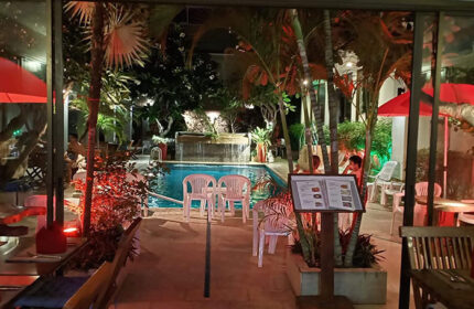 Sansuk Sauna & Guesthouse pool view at night. Adults-only gay hotel in Pattaya, near gay bars. Cheap accommodation with sauna.