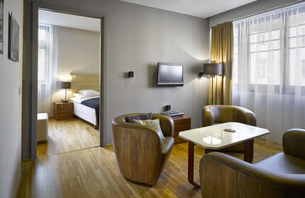 The Icon Hotel and Lounge room in Prague Old Town. Cheap, gay-friendly hotel with lounge area, bedroom view, and modern design. City Center.