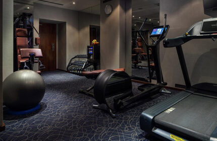 Hotel Kings Court gym in Prague Old Town. Treadmill, elliptical, weights, and exercise ball. A gay-friendly hotel with fitness center.